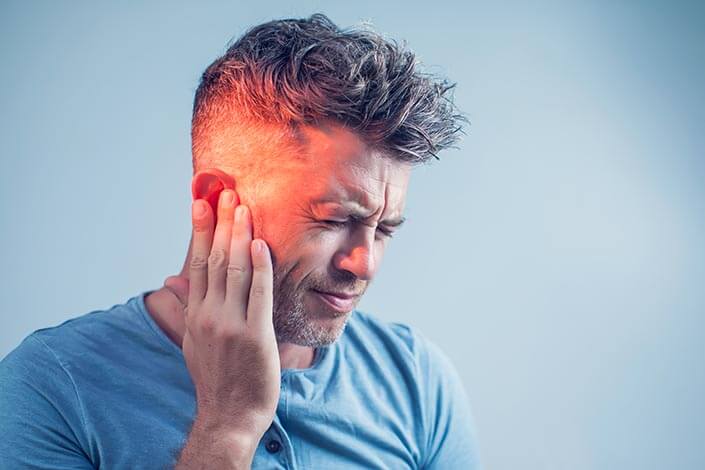 Man Experiencing Ear Pain